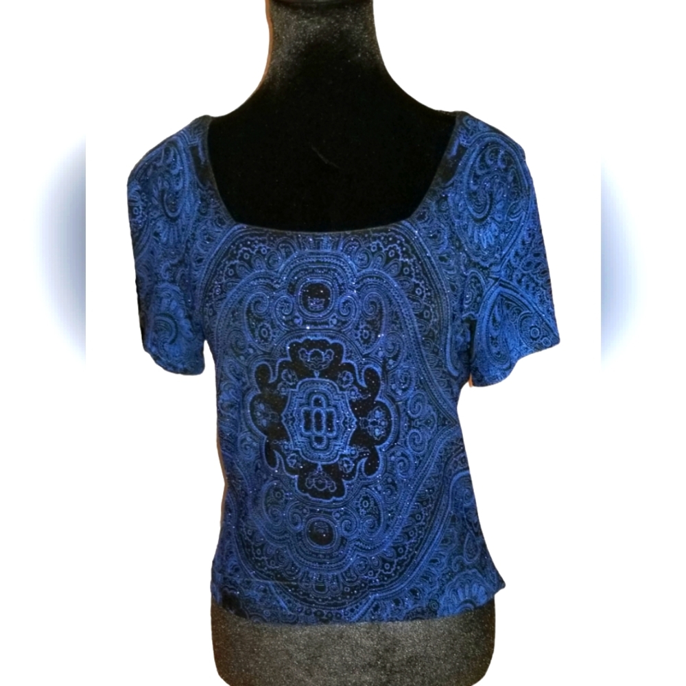 Vibrant MSK Knit top in sapphire blue on black.